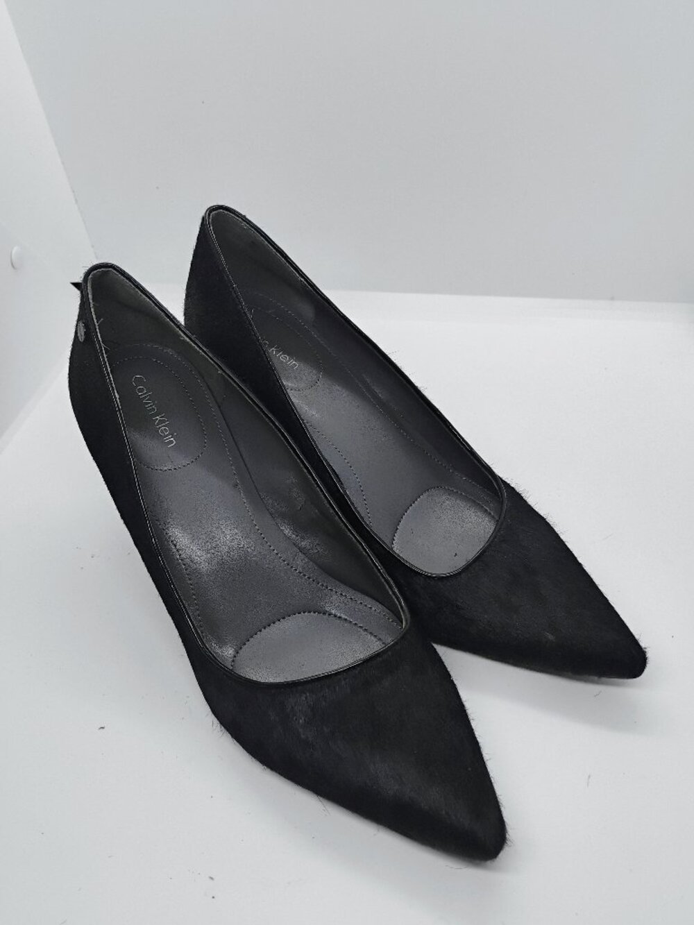 Size 7.5 Calvin Klein black cow hide pointy close toes wedge